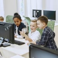 Young children looking at a computer screen